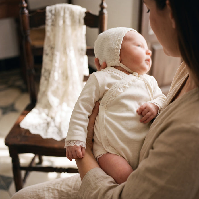 Unisex Beige Crossed Lace Bodysuit Long Sleeve β view 2 β handcrafted in Spain β AGΓ Baby