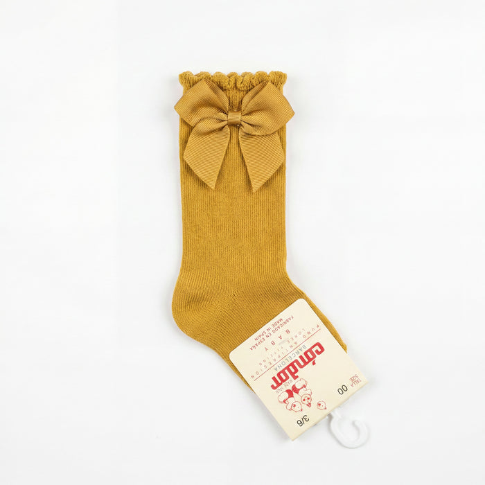 Girl Light Mustard High Socks with Side Bow — view 3 — handcrafted in Spain — AGÜ Baby