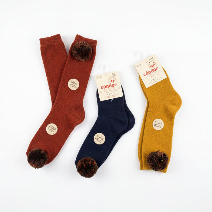 Girl Mustard High Socks with Borlones — view 3 — handcrafted in Spain — AGÜ Baby