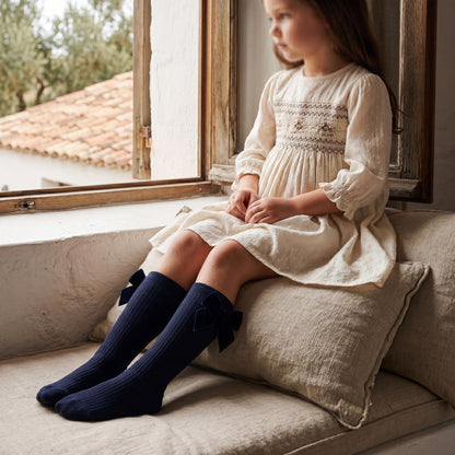 Girl Navy Blue High Socks with Side Velvet Bow — view 2 — handcrafted in Spain — AGÜ Baby