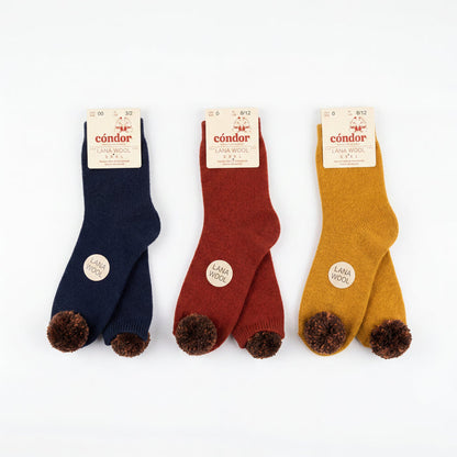Girl Red Wine High Socks with Borlones — view 3 — handcrafted in Spain — AGÜ Baby